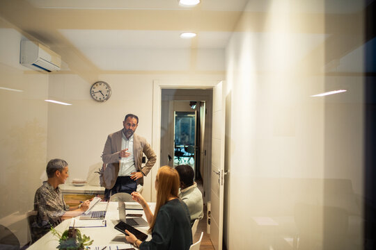 Business team brainstorming in modern conference room