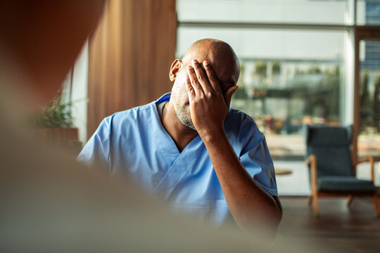 Tired healthcare worker in hospital break room
