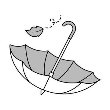 A damaged open umbrella with a detached handle and flying debris.