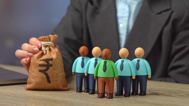 Office workers and the indian rupee money bag. Salaries and bonuses. Profit generated by subordinates. Cost of hiring new employees, training, and professional development.