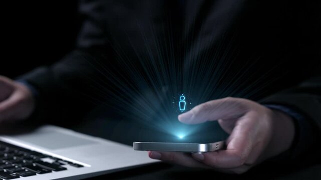 A person interacts with a smartphone while a laptop rests nearby. The image illustrates digital communication, technology, and innovative data visualization in a modern workspace. Qubit