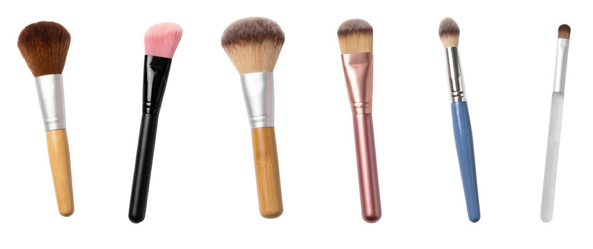 Collection of various professional makeup brushes including powder, blush, foundation, and eyeshadow applicators arranged in a neat row for cosmetic and beauty concepts
