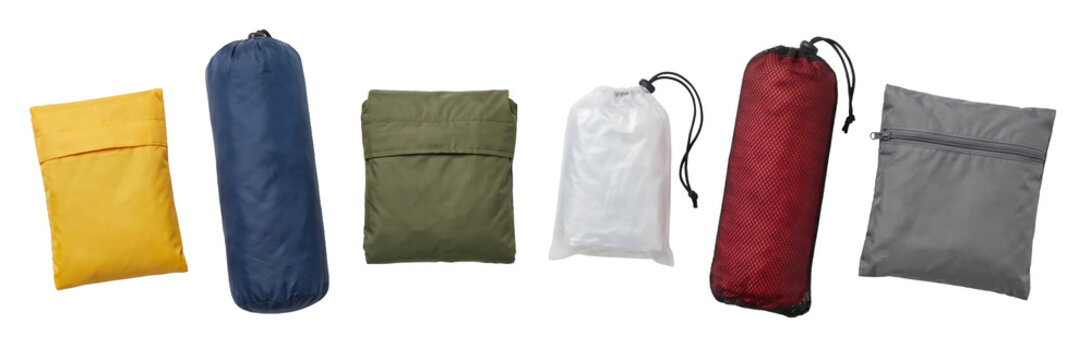 Collection of colorful lightweight travel pouches and stuff sacks for organizing luggage and gear, shown in a neat row with various closure types like drawstrings and zippers