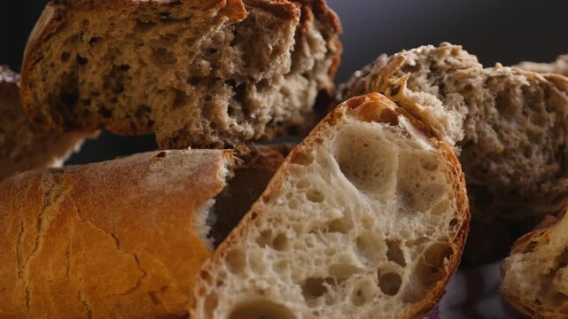 Bread assortment, mixed Spanish baguette loaves from Barcelona bakery, close-up macro shot showing crumb texture