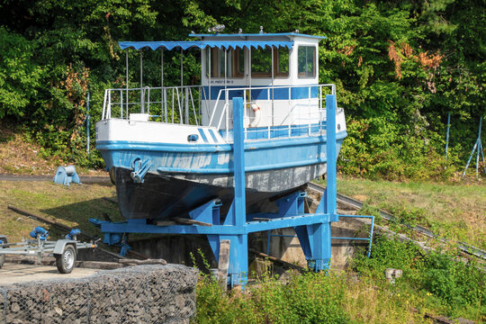 Water company workboat on shore
