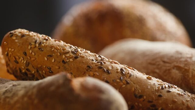 Bread assortment, mixed Spanish baguette loaves from Barcelona bakery, close-up macro shot showing crumb texture