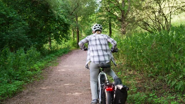 Woman Inviting Viewer To Join Electric Bicycle Ride