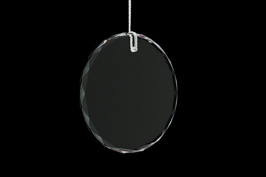 Transparent Crystal Glass Bauble Hanging on Silver Thread on Black Background. 3d rendering