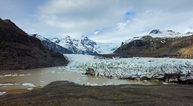 Svinafellsjokull Glacier tongue from vatnajokull glacier meeting a meltwater lake in iceland. Icelandic landscape