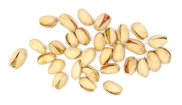 Pistachios pile isolated on white background, top view