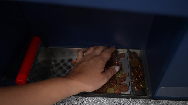 Hand Sorting Euro Coins in a Cash Register Drawer
