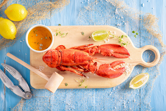 Steamed and fresh lobster with butter and orange sauce.