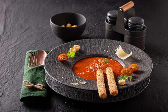 Exquisite and tasty tomato soup as fine dish in restaurant.
