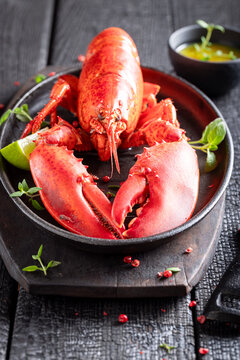 Boiled and spicy lobster with butter and orange sauce.