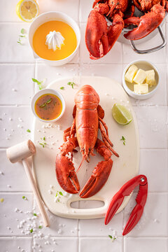 Cooked and tasty lobster with butter and orange sauce.