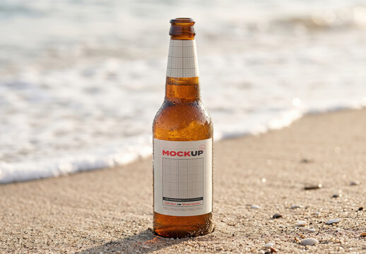 Beer Bottle on Beach Sand with Sea Label Mockup