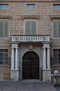 Historic building facade with decorated stone entrance and shutters, Italy, Lombardy, Mantua, 3 June 2026