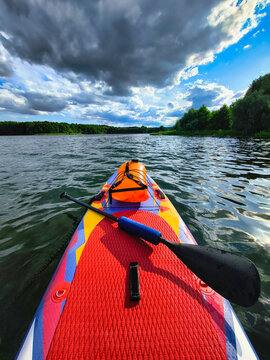 Stand up paddle board on a sunny lake in Poland