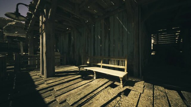 Sunlit wooden shack interior with bench. Weathered planks and slatted walls cast dramatic striped shadows across dustcoated floor, empty bedframe hinting long