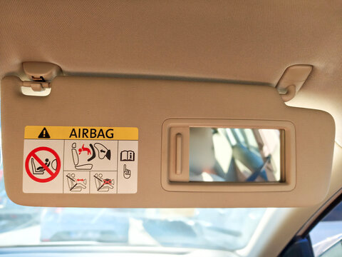 Car Sun Visor with Vanity Mirror and Airbag Warning Label