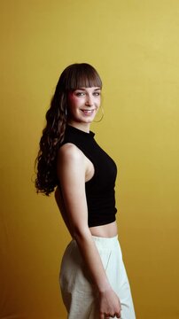 Young stylish woman flirting and winking at camera
