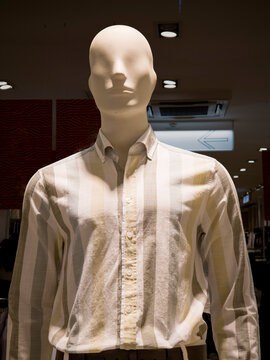 Male Mannequin Wearing Button Up Striped Shirt in Store Display