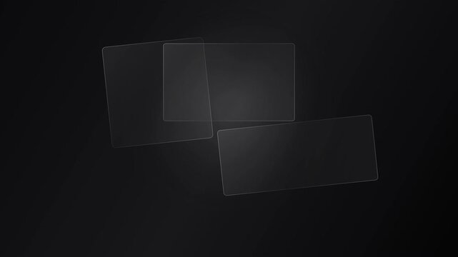 Three transparent glass panes overlapping on dark background
