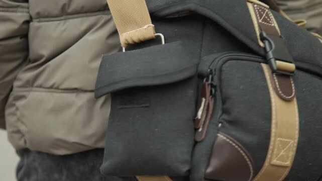 Leather bag options. Bag featuring customizable buckle closure. Leather accents on bag with adaptable strap. Bag decorated with leather accents and adjustable strap with clasp fastening