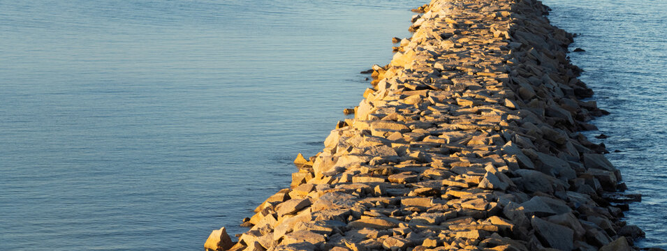 Sunset light on the Granite Island stone jetty in Victor Harbor South Australia
