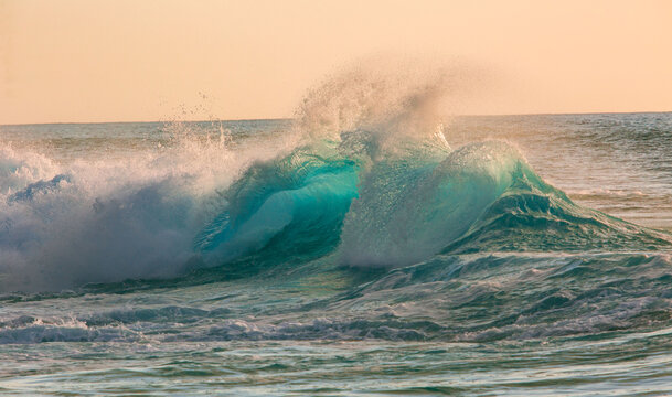 Golden Hour Ocean Wave Backlit Turquoise Water Splash at Sunset