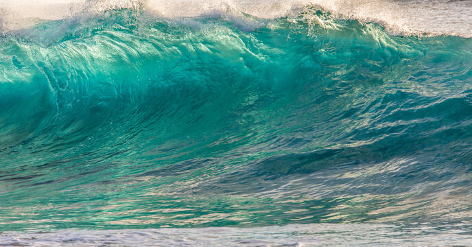 Close Up of Large Turquoise Ocean Wave Wall Texture and Ripple Patterns