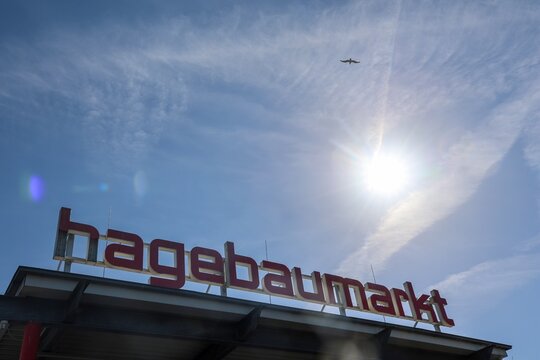 Kiel, Germany - 27. July 2026: Hagebaumarkt sign under bright sun in Kiel sky