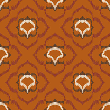 Seamless ethnic ikat pattern with terracotta orange floral ogee medallion ornament. Embroidered stitch texture design for bohemian fabric, textile, apparel, wallpaper, and background.