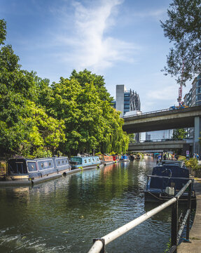 Canal boats moored in the Paddington Basin canal, near Little Venice in London.