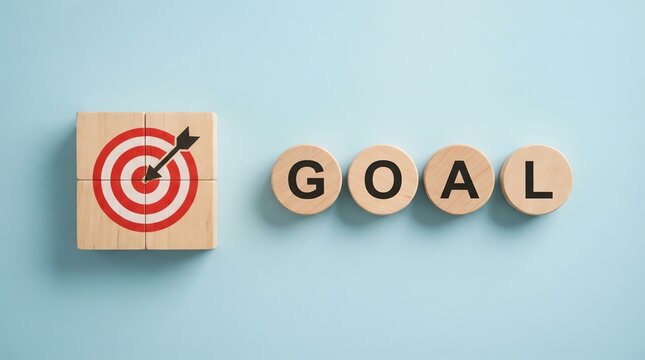Achieving objectives Wooden target with the word GOAL spelled out on wooden discs, symbolizing success and achievement