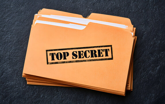 Yellow file with documents and Top Secret stamp on black table, top view