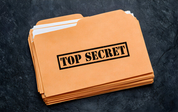 Yellow file with documents and Top Secret stamp on black table, top view