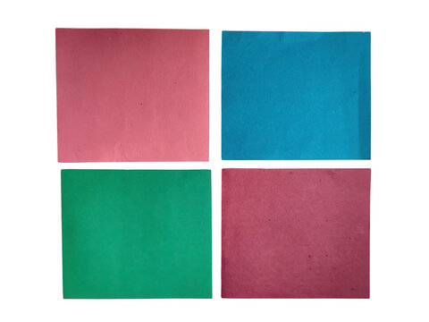 Four solid colored paper squares background