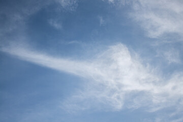 Fototapeta premium blue sky with a dramatic scattering of white clouds. blue sky background.