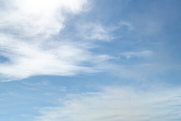 Obraz premium blue sky with a dramatic scattering of white clouds. blue sky background.