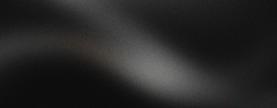 Elegant black silk fabric texture with soft waves. Luxurious dark satin material background for fashion and beauty branding. Smooth charcoal textile surface with subtle lighting and shadows.