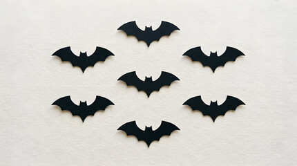 Fototapeta premium Many black paper bats flying in a group for a spooky halloween holiday decoration project