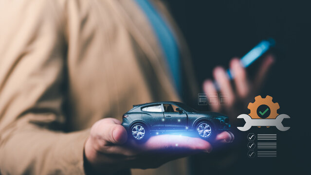 Auto service technician manages digital car maintenance, vehicle inspection, repair service, preventive maintenance, service scheduling, automotive diagnostics, vehicle care through mobile technology.