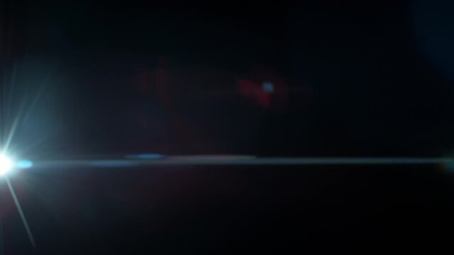 Real Shooted Anamorphic Lens Flare on Black Background in Super Slow Motion.