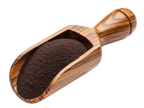 Wooden scoop filled with dark grains or seeds against a plain background