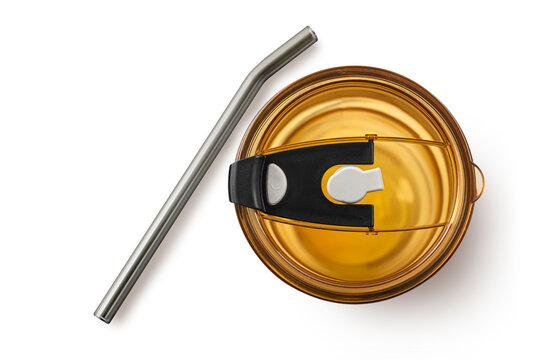 Amber-colored tumbler lid with a slider and reusable metal straw isolated on white background. Perfect for eco-friendly lifestyle products and drinkware accessory mockups.