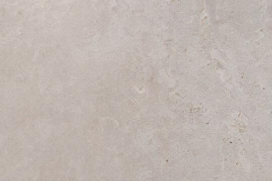 Travertine slab background in blush neutral with left half copy space