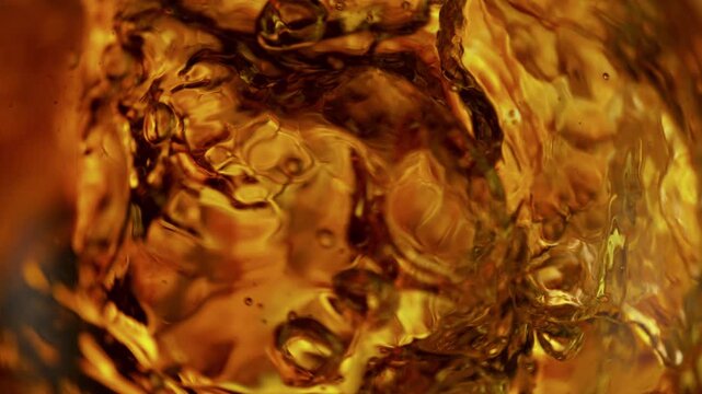 Super Slow Motion Shot of Waving Golden Liquid Background at 1000fps.