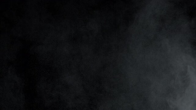 Super Slow Motion Shot of Dust Atmospheric Particles Floating in Air Isolated on Black Background at 1000fps.