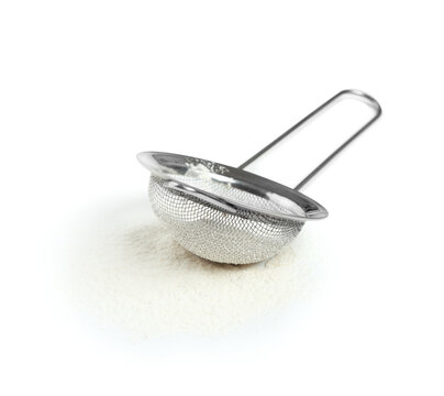 Stainless steel mesh sieve with flour baking and cooking preparation kitchen utensil for sifting ingredients isolated on white background